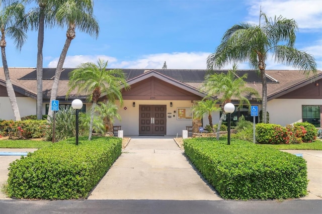 7301 29th Avenue Dr W Unit 108, Bradenton, FL 34209 - single story home with french doors, driveway, and stucco siding