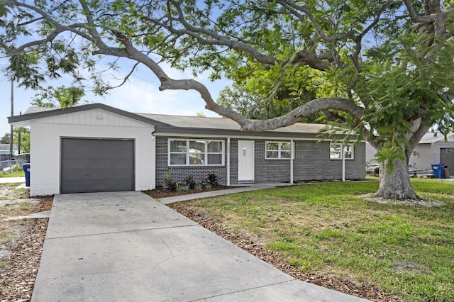 3303 32nd St W, Bradenton, FL 34205 - ranch-style home with an attached garage, brick siding, driveway, and a front lawn