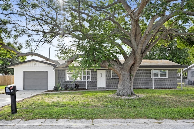 3303 32nd St W, Bradenton, FL 34205 - ranch-style home featuring brick siding, a garage, concrete driveway, and central AC