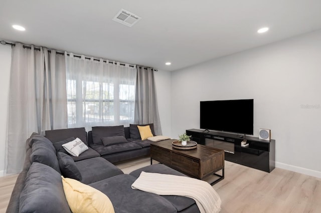 3303 32nd St W, Bradenton, FL 34205 - living room featuring light wood finished floors, baseboards, and recessed lighting