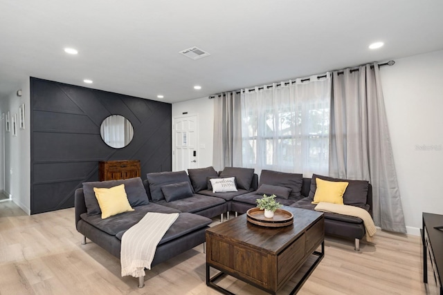 3303 32nd St W, Bradenton, FL 34205 - living area featuring light wood-style flooring, recessed lighting, baseboards, and an accent wall