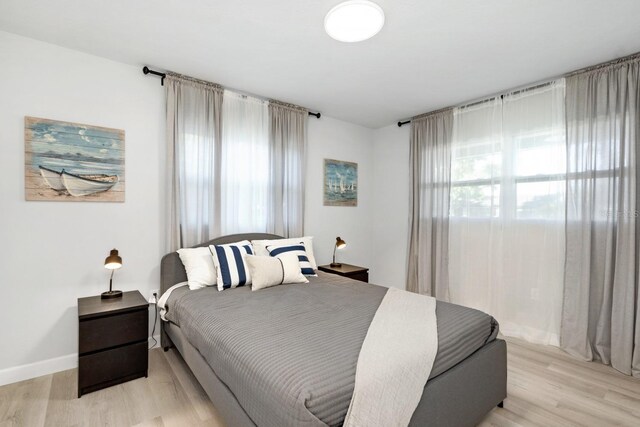 3303 32nd St W, Bradenton, FL 34205 - bedroom with light wood-style floors and baseboards