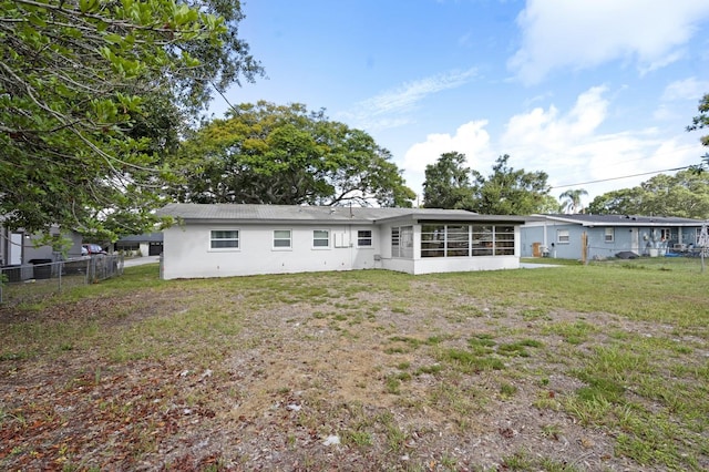 3303 32nd St W, Bradenton, FL 34205 - rear view of house featuring a sunroom
