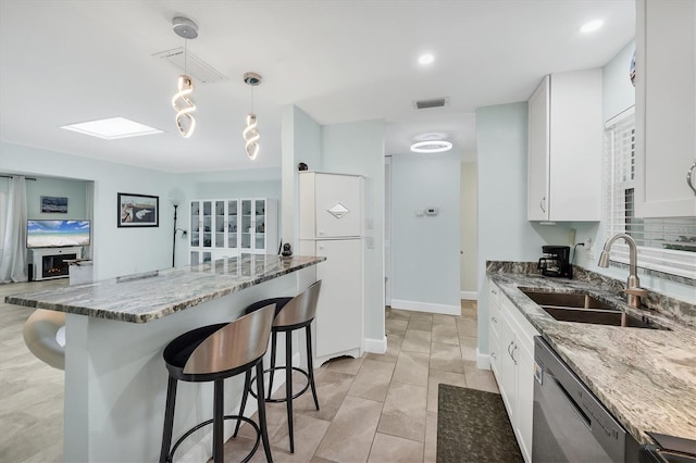 3500 Green View Ct Unit 45, Sarasota, FL 34231 - kitchen featuring a sink, stainless steel dishwasher, a kitchen bar, stone counters, and recessed lighting