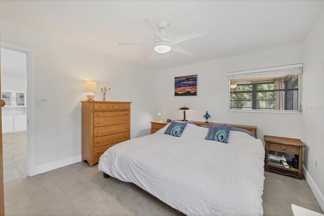 3500 Green View Ct Unit 45, Sarasota, FL 34231 - bedroom featuring light tile patterned floors, baseboards, and ceiling fan