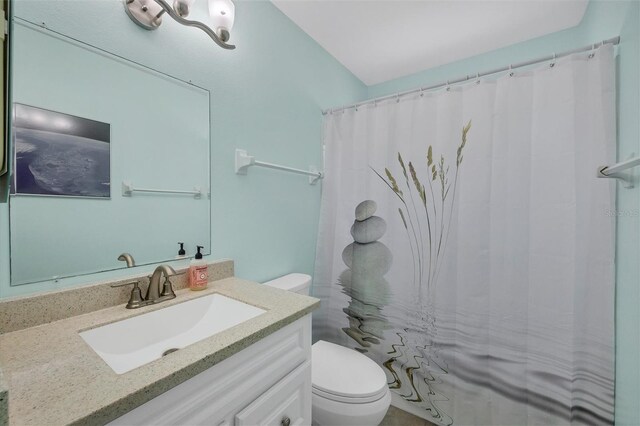3500 Green View Ct Unit 45, Sarasota, FL 34231 - bathroom with toilet, vanity, and a shower with shower curtain