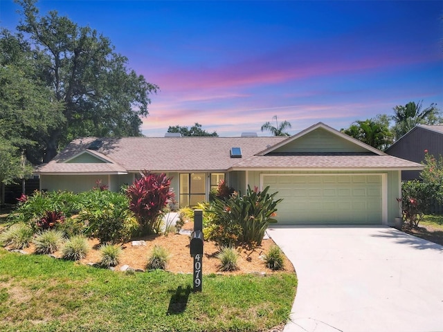 4079 Woodview Dr, Sarasota, FL 34232 - single story home featuring driveway, an attached garage, and a shingled roof