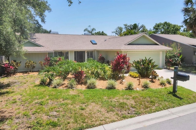 4079 Woodview Dr, Sarasota, FL 34232 - ranch-style home with an attached garage, a front lawn, concrete driveway, and a shingled roof