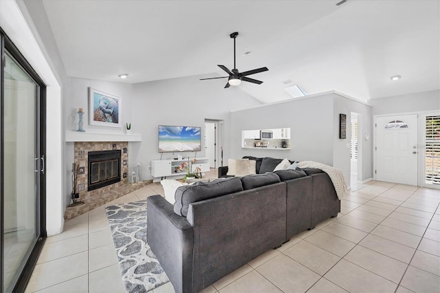 4079 Woodview Dr, Sarasota, FL 34232 - living area with light tile patterned flooring, vaulted ceiling, a brick fireplace, ceiling fan, and recessed lighting