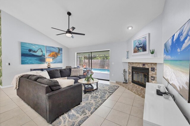 4079 Woodview Dr, Sarasota, FL 34232 - living area with light tile patterned flooring, ceiling fan, a tile fireplace, high vaulted ceiling, and baseboards