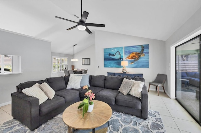 4079 Woodview Dr, Sarasota, FL 34232 - living room with light tile patterned flooring, vaulted ceiling, ceiling fan, and baseboards