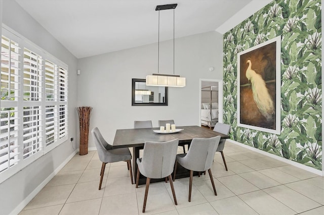 4079 Woodview Dr, Sarasota, FL 34232 - dining area with lofted ceiling, baseboards, and light tile patterned flooring