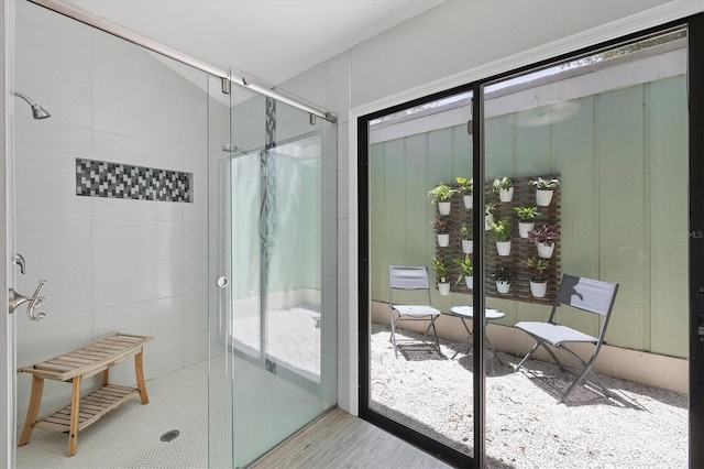 4079 Woodview Dr, Sarasota, FL 34232 - bathroom featuring a shower stall and wood finished floors