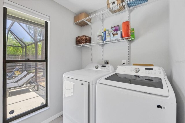 4079 Woodview Dr, Sarasota, FL 34232 - laundry area with washer and clothes dryer and baseboards