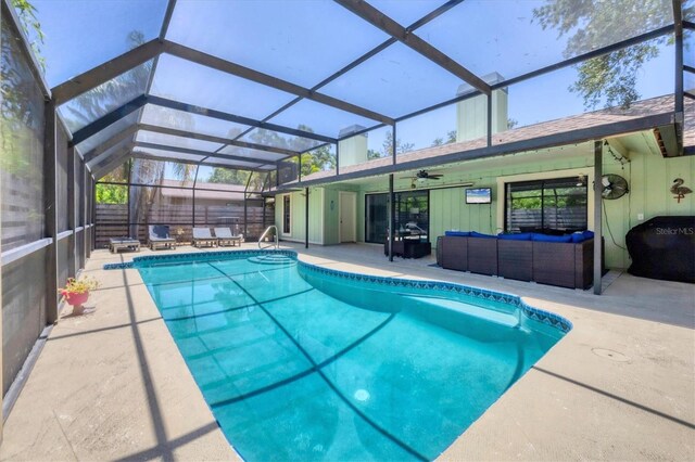 4079 Woodview Dr, Sarasota, FL 34232 - outdoor pool with outdoor lounge area, a patio, a ceiling fan, and glass enclosure