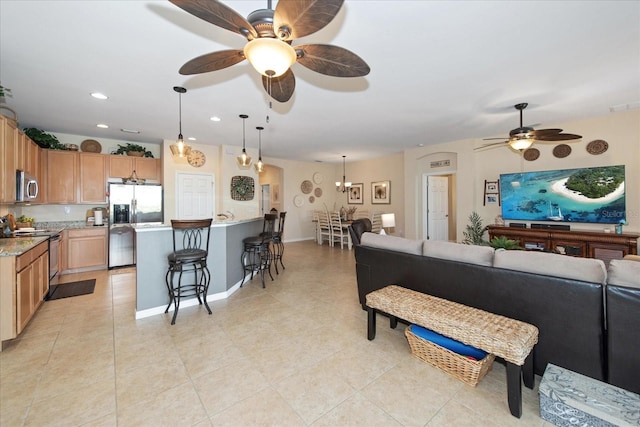3230 Magnolia Landing Ln, North Fort Myers, FL 33917 - living room with a ceiling fan, light tile patterned floors, recessed lighting, and baseboards
