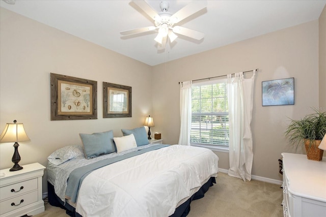 3230 Magnolia Landing Ln, North Fort Myers, FL 33917 - bedroom with light carpet, baseboards, and a ceiling fan