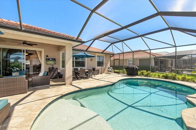 3230 Magnolia Landing Ln, North Fort Myers, FL 33917 - outdoor pool featuring a patio area, a ceiling fan, outdoor dining space, and glass enclosure