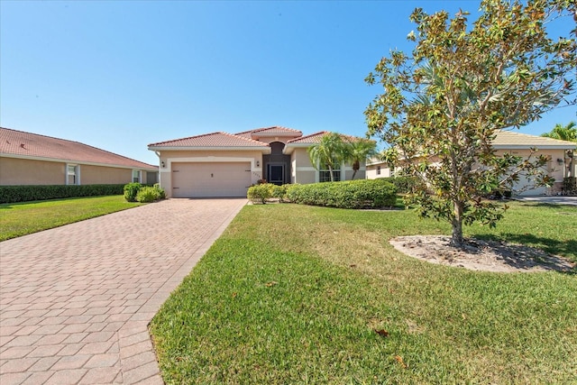 3230 Magnolia Landing Ln, North Fort Myers, FL 33917 - mediterranean / spanish home with decorative driveway, stucco siding, a tile roof, a garage, and a front yard