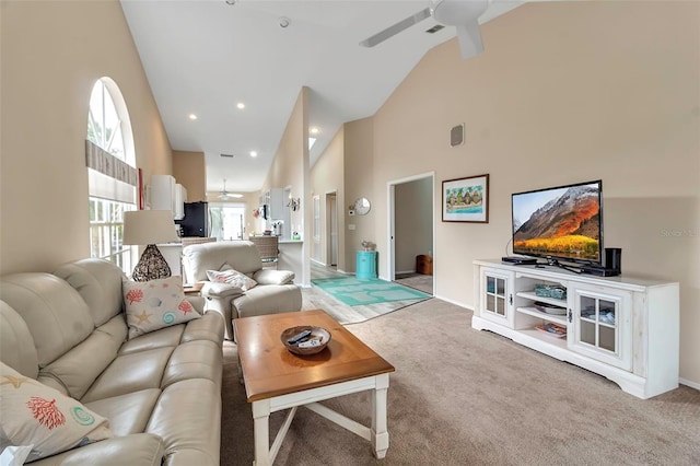 1322 Perico Point Cir, Bradenton, FL 34209 - living area with ceiling fan, light carpet, high vaulted ceiling, and baseboards