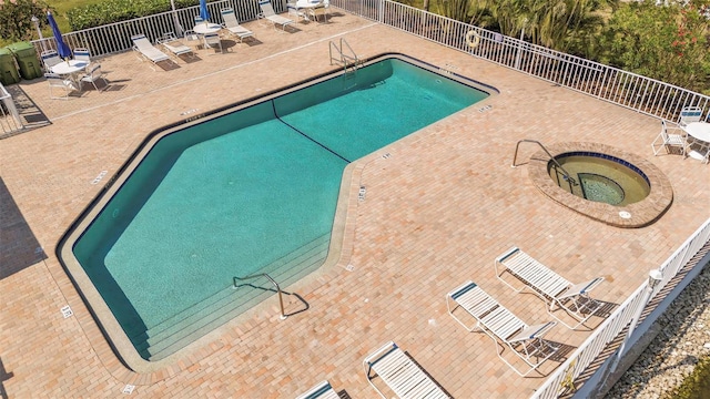 1322 Perico Point Cir, Bradenton, FL 34209 - community pool with a hot tub, fence, and a patio area