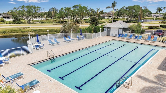 1322 Perico Point Cir, Bradenton, FL 34209 - community pool featuring fence, a water view, and a patio