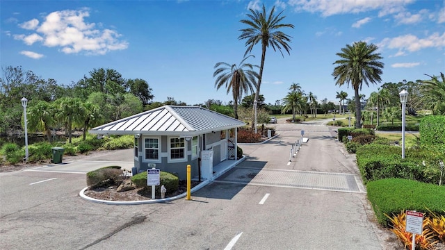1322 Perico Point Cir, Bradenton, FL 34209 - view of front of home featuring a standing seam roof, metal roof, and uncovered parking