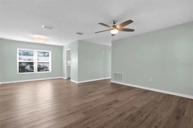 913 64th St W, Bradenton, FL 34209 - empty room with ceiling fan, wood finished floors, and baseboards
