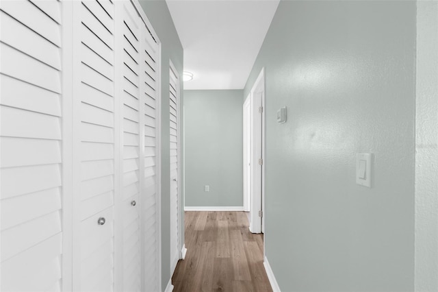 913 64th St W, Bradenton, FL 34209 - hall with dark wood-style flooring and baseboards