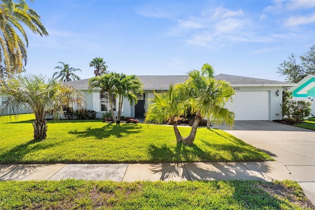 913 64th St W, Bradenton, FL 34209 - single story home featuring an attached garage, driveway, a front lawn, and stucco siding