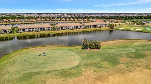 aerial view of residential area with a nearby body of water and a golf club