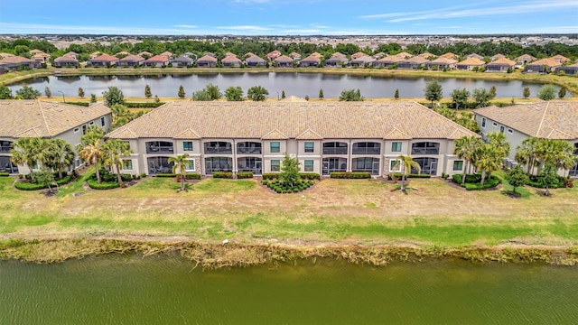 aerial view of residential area with a large body of water