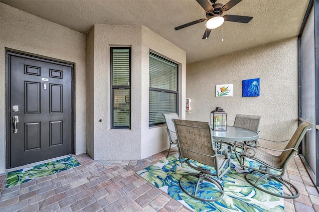 view of patio / terrace featuring a ceiling fan and outdoor dining space