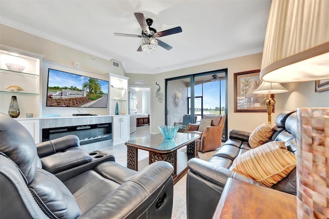 living area with ceiling fan and crown molding