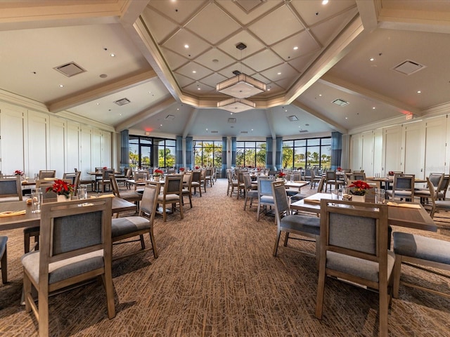 carpeted dining area with high vaulted ceiling, beam ceiling, and a decorative wall