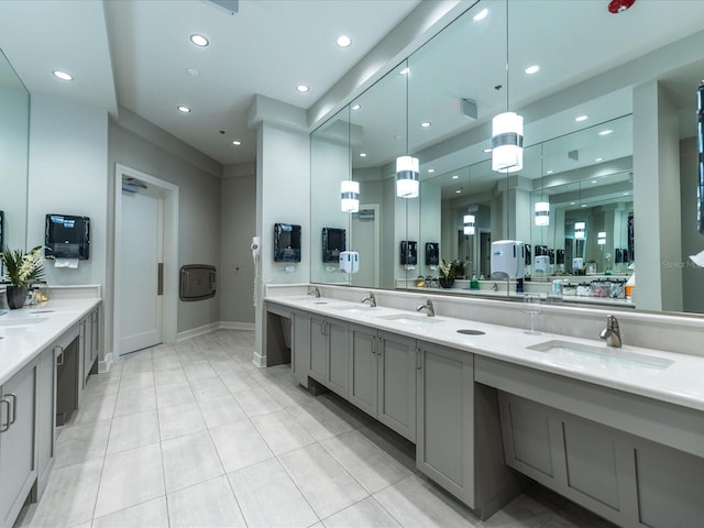 full bath featuring recessed lighting, double vanity, and tile patterned floors