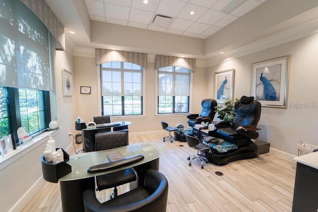 office featuring baseboards, wood finished floors, and a drop ceiling