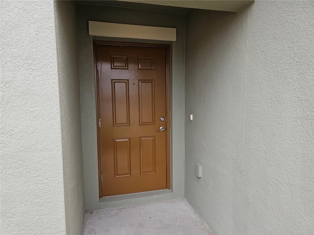 13156 Merlot Sunstone Cv, Parrish, FL 34219 - doorway to property featuring stucco siding