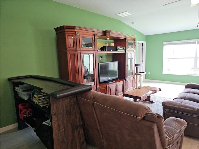13156 Merlot Sunstone Cv, Parrish, FL 34219 - living room with vaulted ceiling, baseboards, and a ceiling fan