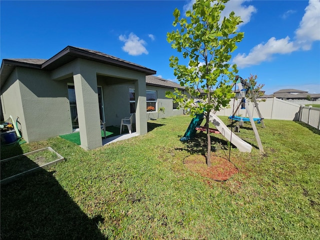 13156 Merlot Sunstone Cv, Parrish, FL 34219 - view of yard with a trampoline and a patio area