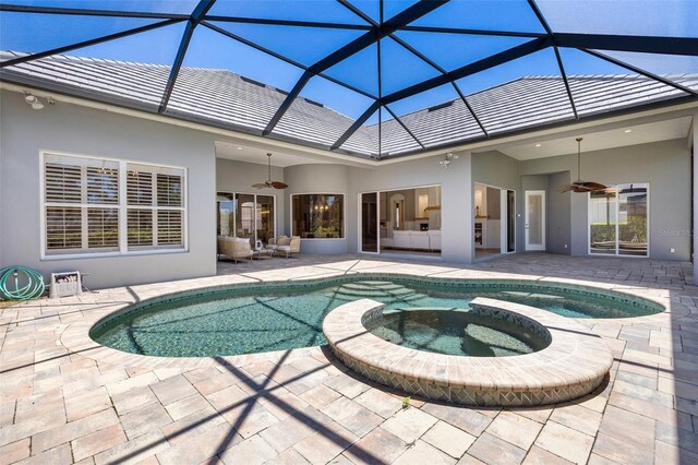 52 Grande Fairway, Englewood, FL 34223 - view of swimming pool with a ceiling fan, a patio, a pool with connected hot tub, and a lanai