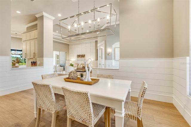 52 Grande Fairway, Englewood, FL 34223 - dining room with wainscoting, light wood-style floors, recessed lighting, and crown molding