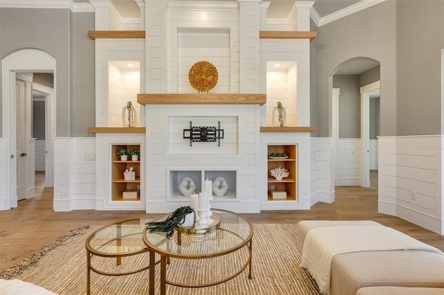 52 Grande Fairway, Englewood, FL 34223 - living area featuring arched walkways, ornamental molding, and wood finished floors