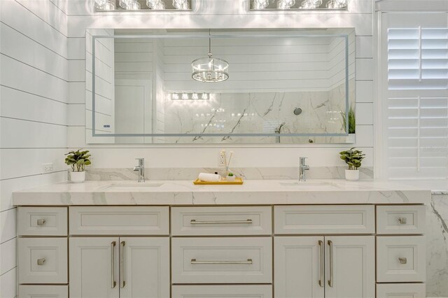52 Grande Fairway, Englewood, FL 34223 - full bathroom featuring a chandelier and double vanity