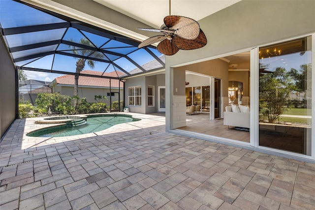 52 Grande Fairway, Englewood, FL 34223 - view of swimming pool with a ceiling fan, a patio, a pool with connected hot tub, and glass enclosure