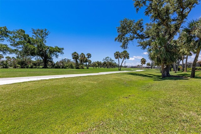 52 Grande Fairway, Englewood, FL 34223 - surrounding community with a lawn