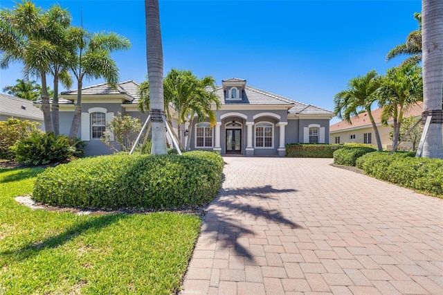52 Grande Fairway, Englewood, FL 34223 - view of front of house featuring french doors and stucco siding