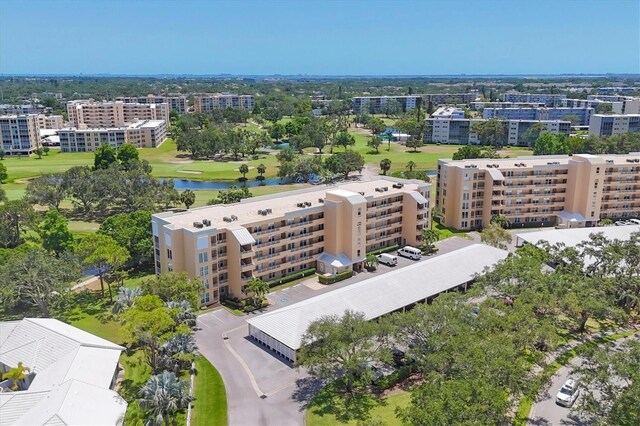 3750 Pinebrook Cir Unit 405, Bradenton, FL 34209 - aerial view of apartment complex, a nearby body of water, a golf club, and a tree filled landscape
