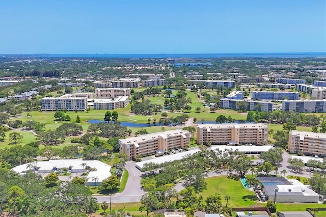 3750 Pinebrook Cir Unit 405, Bradenton, FL 34209 - drone / aerial view of apartment complex / building, a large body of water, and a local golf course