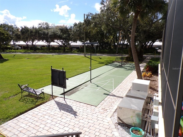 3750 Pinebrook Cir Unit 405, Bradenton, FL 34209 - view of community featuring shuffleboard and a yard